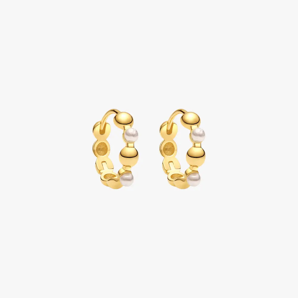 Geometric gold hoop earrings with pearls, blending modern design with classic elements.