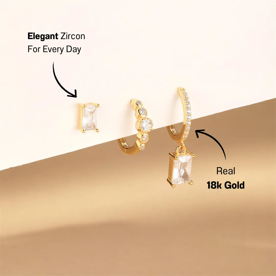 Geometric Zircon Earring Set displayed on a soft background, showing gold and zircon design.