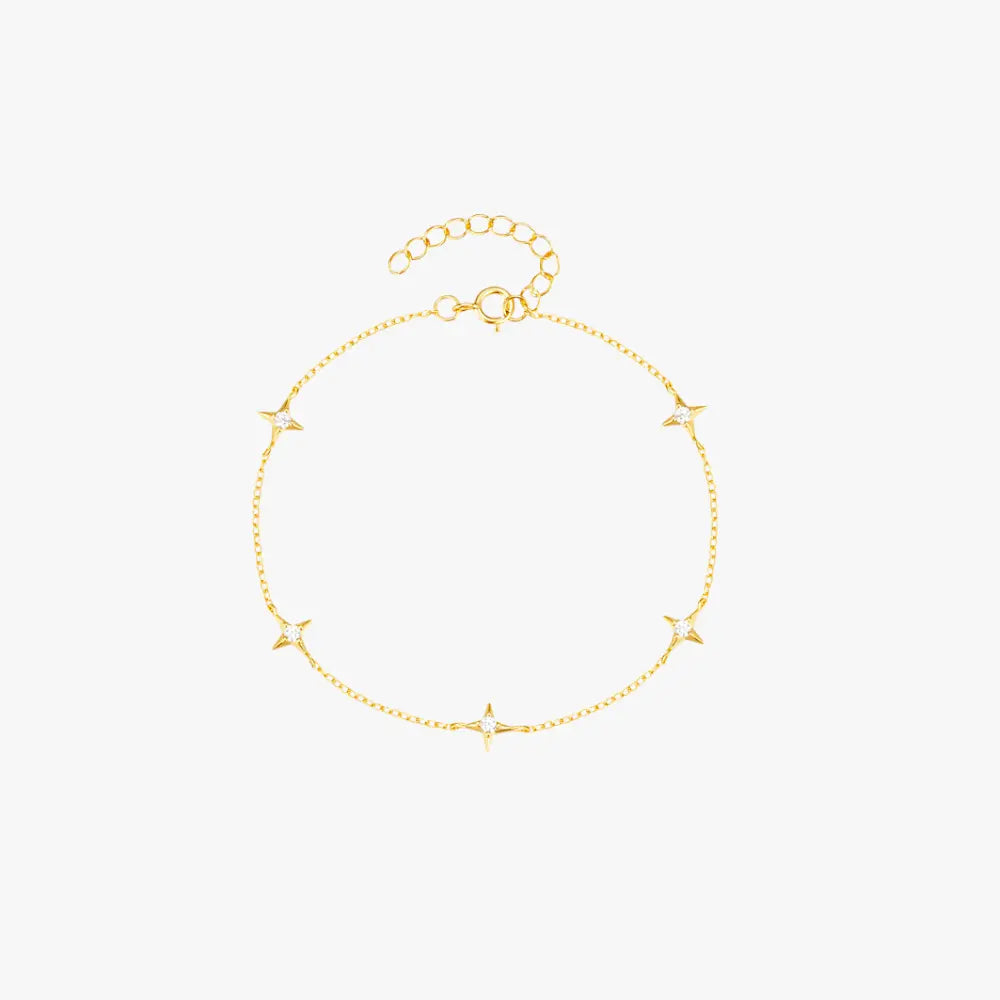 Delicate gold bracelet with star charms, perfect for layering and adding a celestial touch.