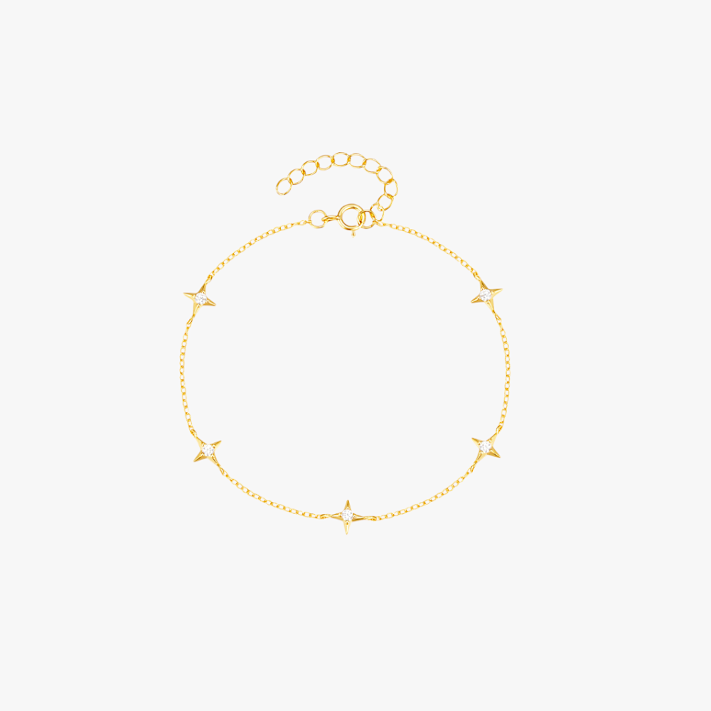 Delicate gold bracelet with star charms, perfect for layering and adding a celestial touch.