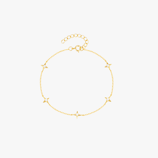 Delicate gold bracelet with star charms, perfect for layering and adding a celestial touch.