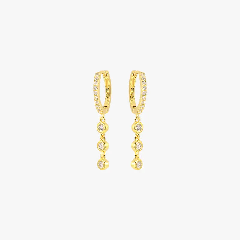 Gold crystal drop earrings for women, featuring a minimalist design with four bezel-set stones.