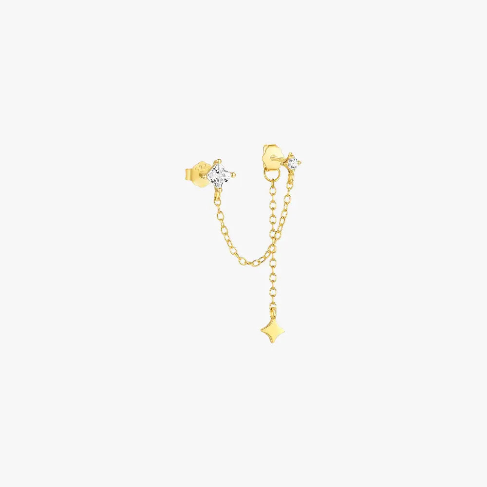 Gold crystal drop earrings with star charm, offering a minimalist and refined look.