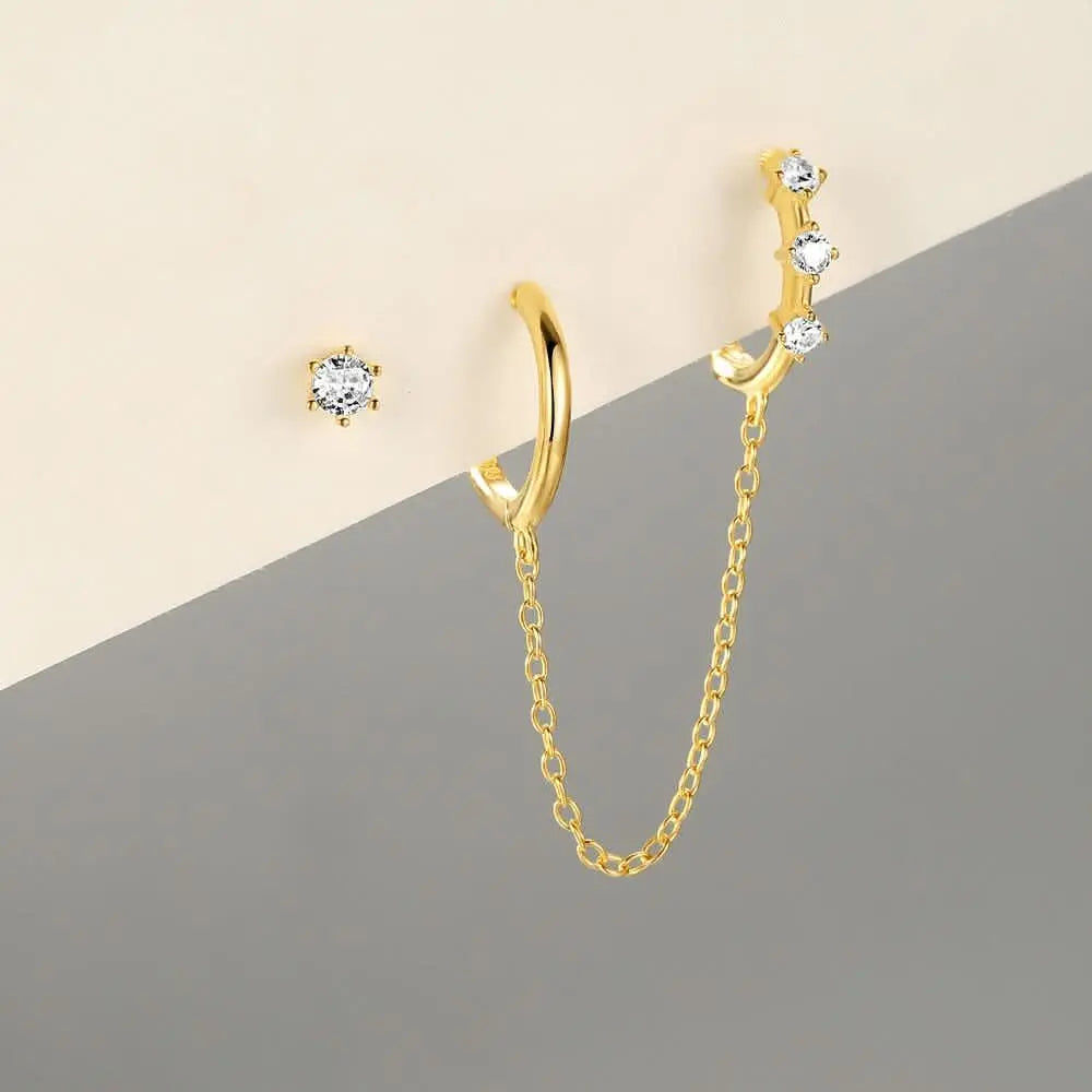 Gold diamond huggie earring with chain and solitaire stud, minimalist jewelry for women.