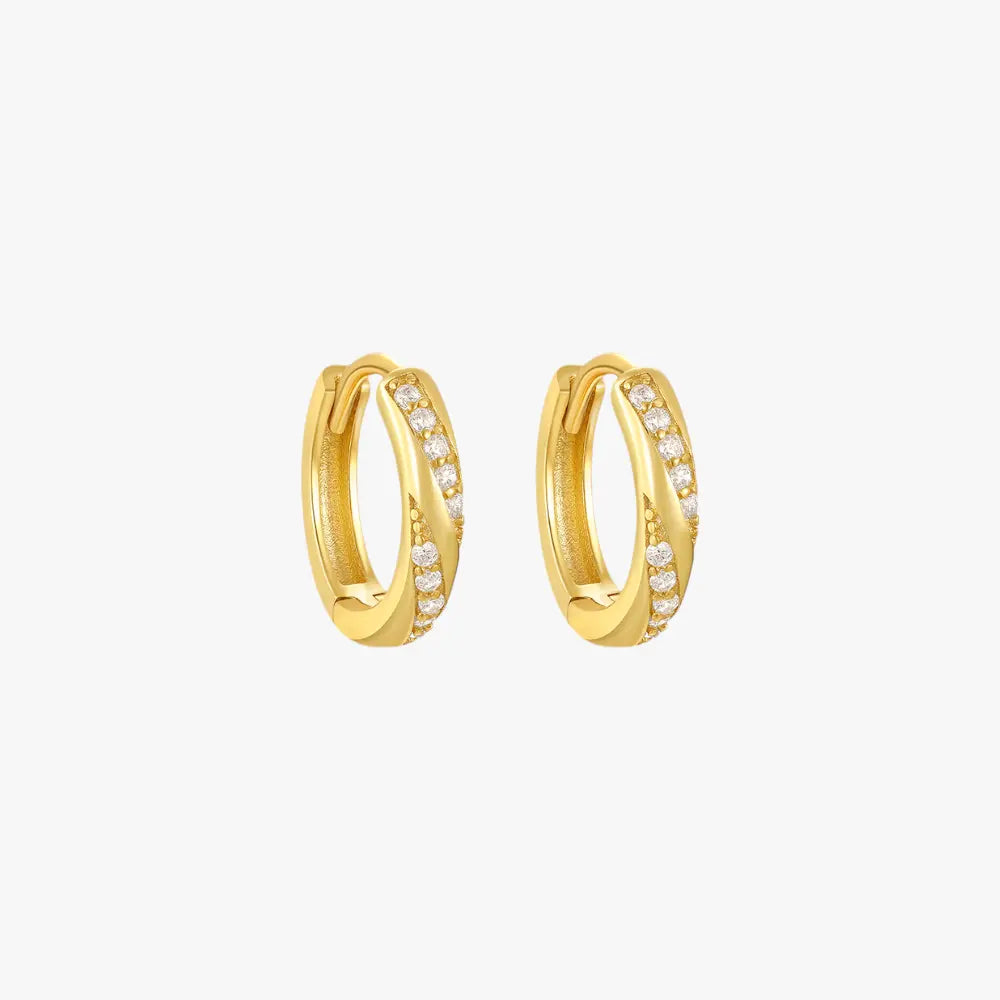 Gold diamond twist hoop earrings for women, offering a chic and contemporary design.