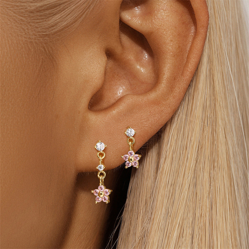 Stunning floral dangle earrings crafted from 925 sterling silver with 18K gold plating and sparkling pink cubic zirconia stones. Perfect for daily wear.