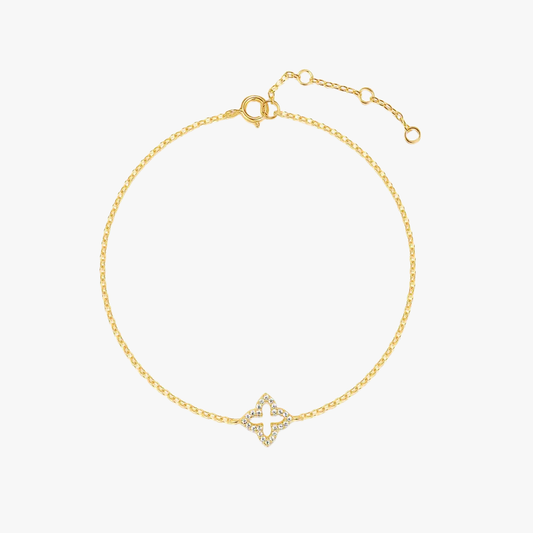 Gold flower bracelet featuring a diamond charm for a sophisticated style