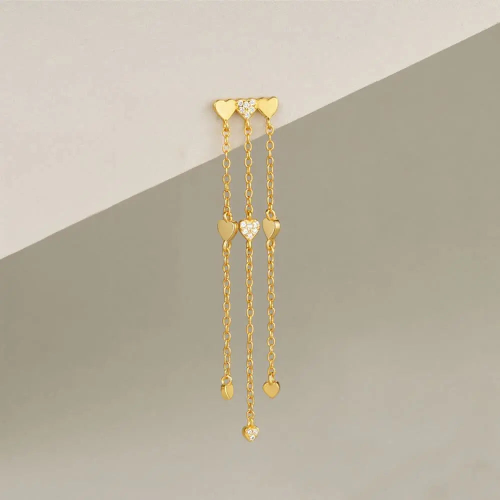 Gold layered heart charm earrings with dangling chain, a chic and elegant piece for women’s jewelry.