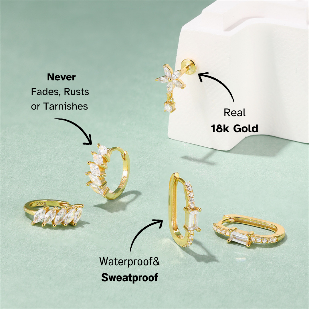 A stylish collection of gold huggie earrings with zirconia stones, including marquise, baguette, and classic round cuts.