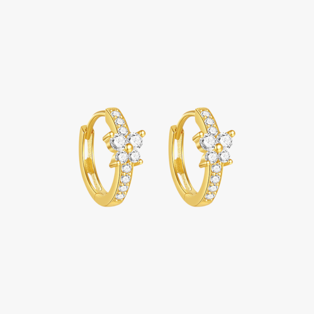 Gold huggie hoop earrings with flower cubic zirconia accents, crafted from 925 sterling silver for an elegant everyday look.