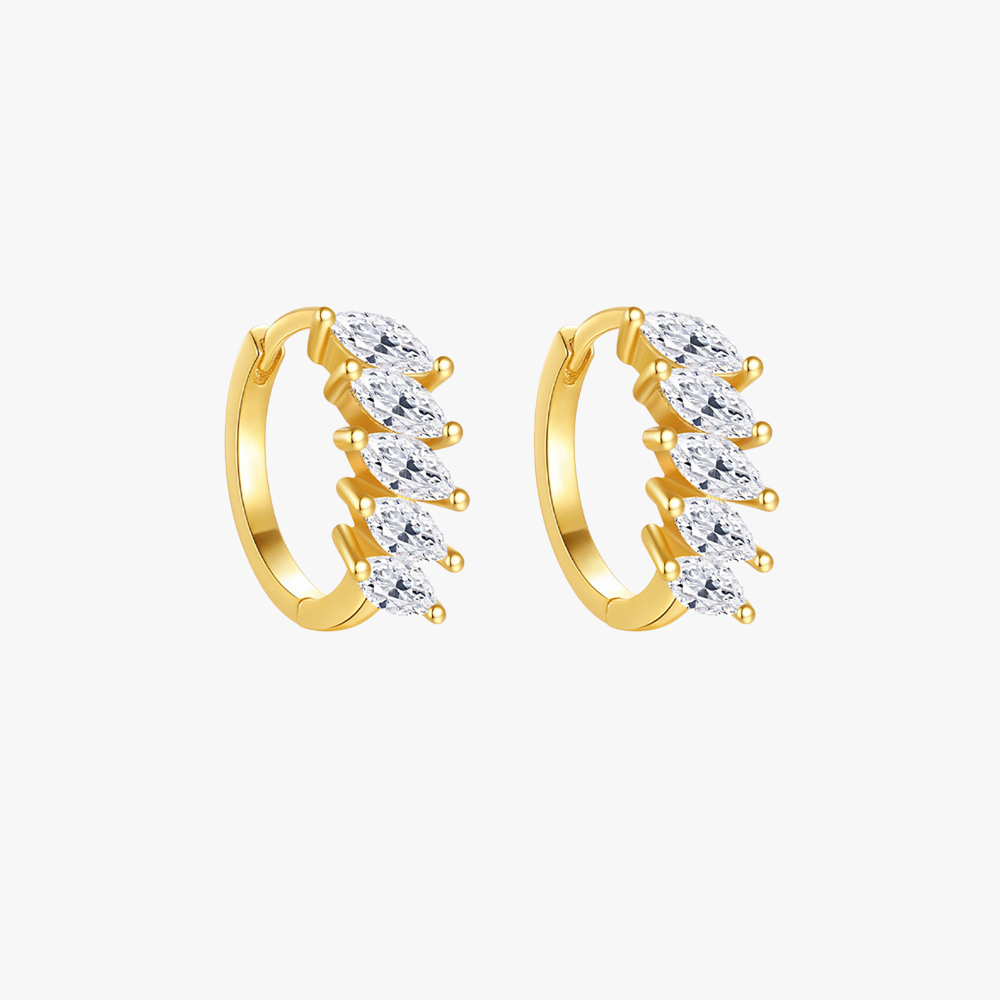 Gold huggie hoop earrings with marquise-cut zircon stones, elegant and minimalist design.