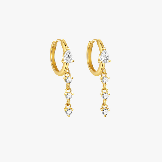 Elegant gold huggie hoop earrings with teardrop cubic zirconia dangles. A modern and stylish jewelry piece for any occasion.