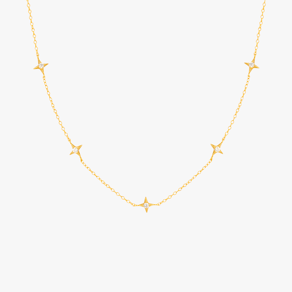 Gold necklace featuring multiple star pendants with diamonds, ideal for a celestial-inspired look.