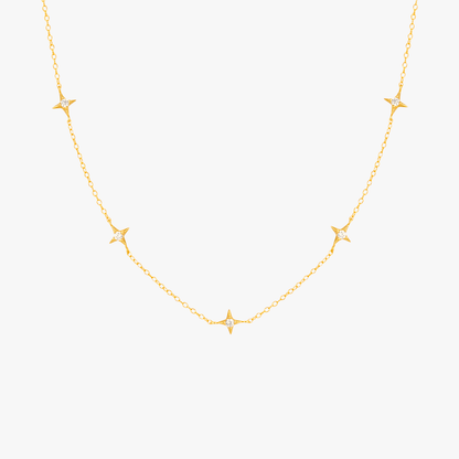 Gold necklace featuring multiple star pendants with diamonds, ideal for a celestial-inspired look.