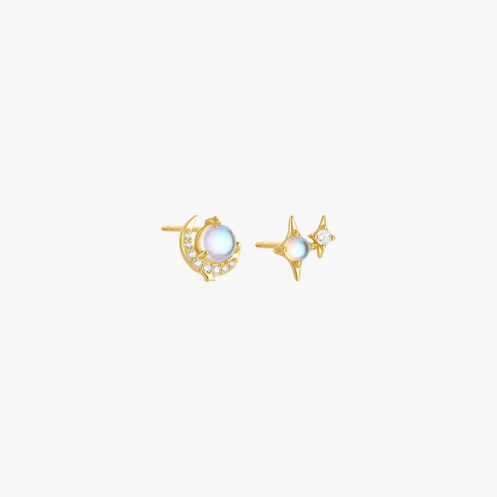 Gold opal moon and star stud earrings with diamonds.