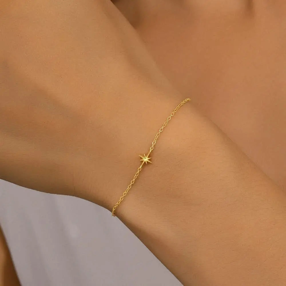 Sleek gold bracelet with a star charm, a simple and elegant jewelry choice.