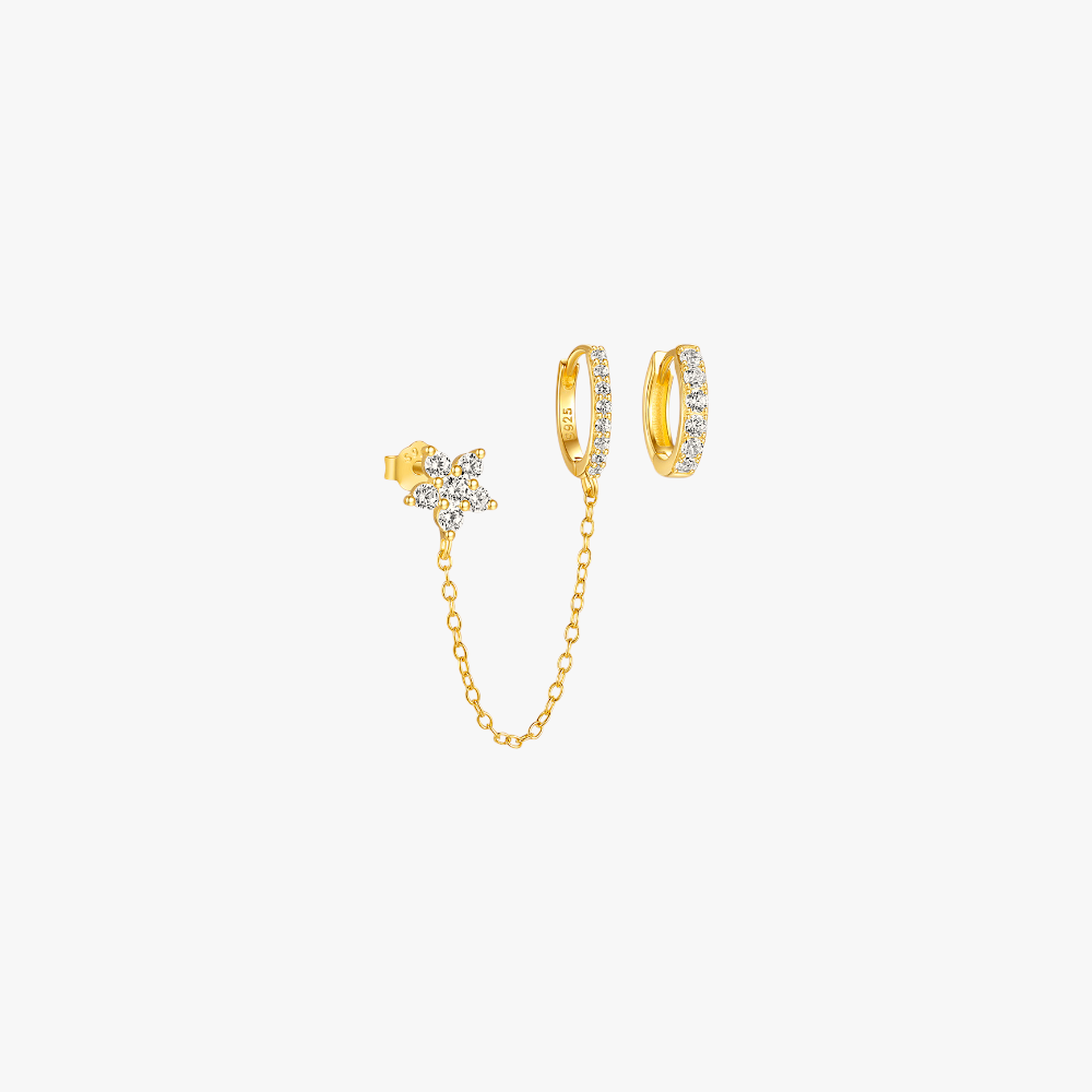 Gold star chain earrings with diamond accents, perfect for adding a touch of elegance to your outfit.