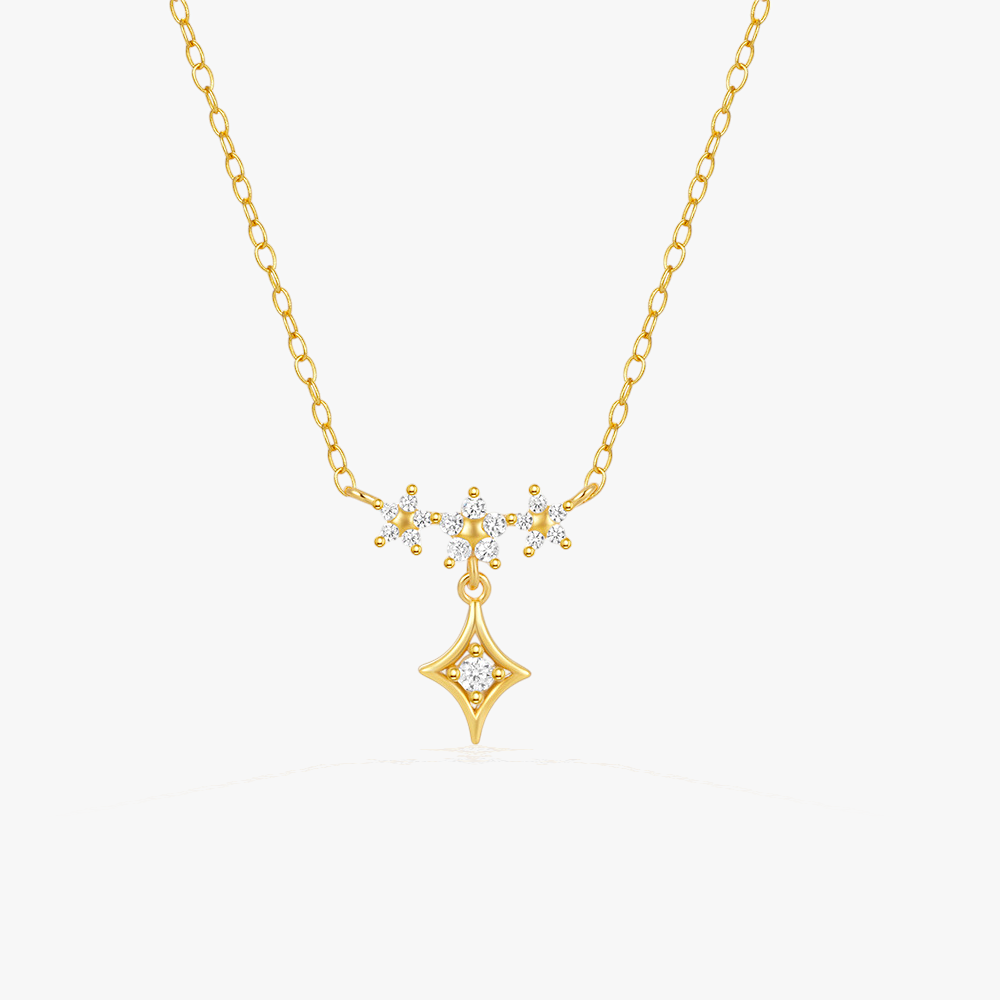 Elegant gold star pendant necklace with diamond accents, perfect for a minimalistic and chic look.