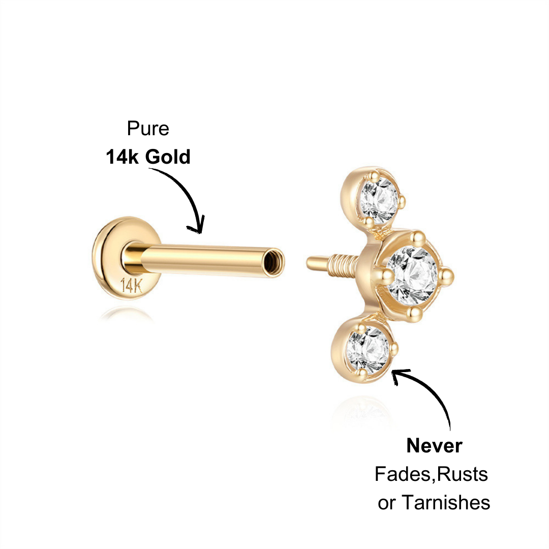 Elegant gold triple-stone labret earring with bezel-set cubic zirconia, perfect for stacking.