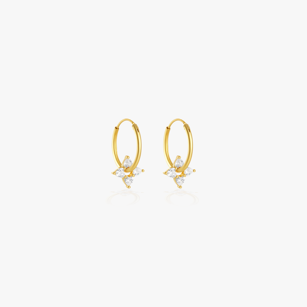 Gold round stud earrings with diamond-like stones for a minimalist yet sophisticated look.