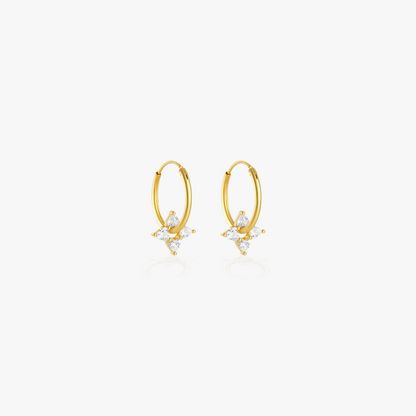 Gold round stud earrings with diamond-like stones for a minimalist yet sophisticated look.