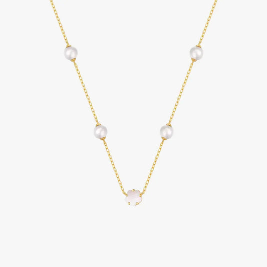 Stylish golden necklace with pearls and a white clover charm, crafted from 925 sterling silver.