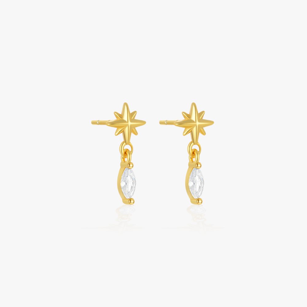 Golden star-shaped earrings with a diamond drop, perfect for adding sparkle to any look.