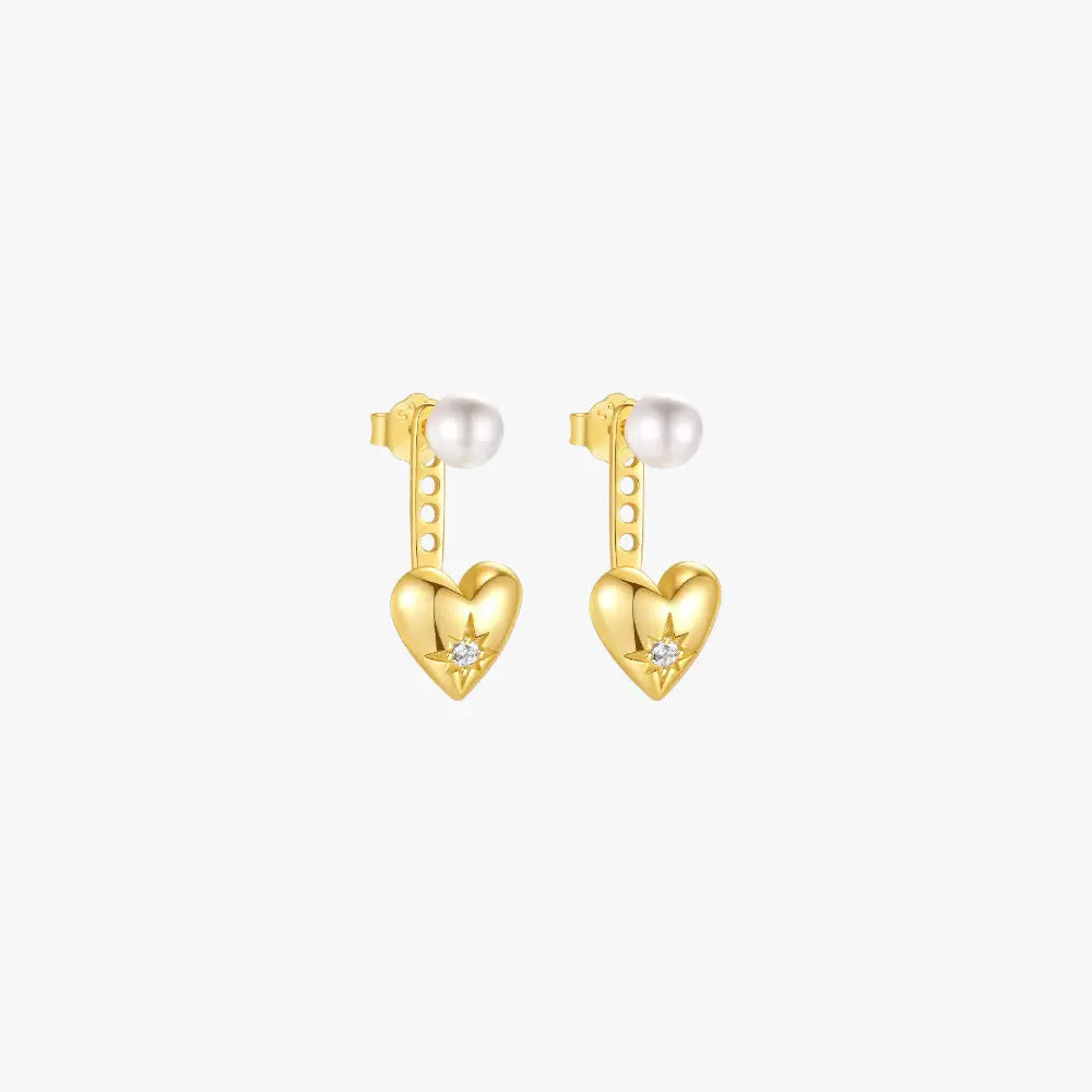 Gold heart-shaped earrings with pearl and star detailing, perfect for a stylish look.