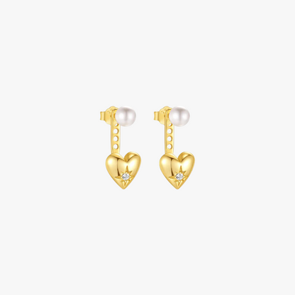 Gold heart-shaped earrings with pearl and star detailing, perfect for a stylish look.