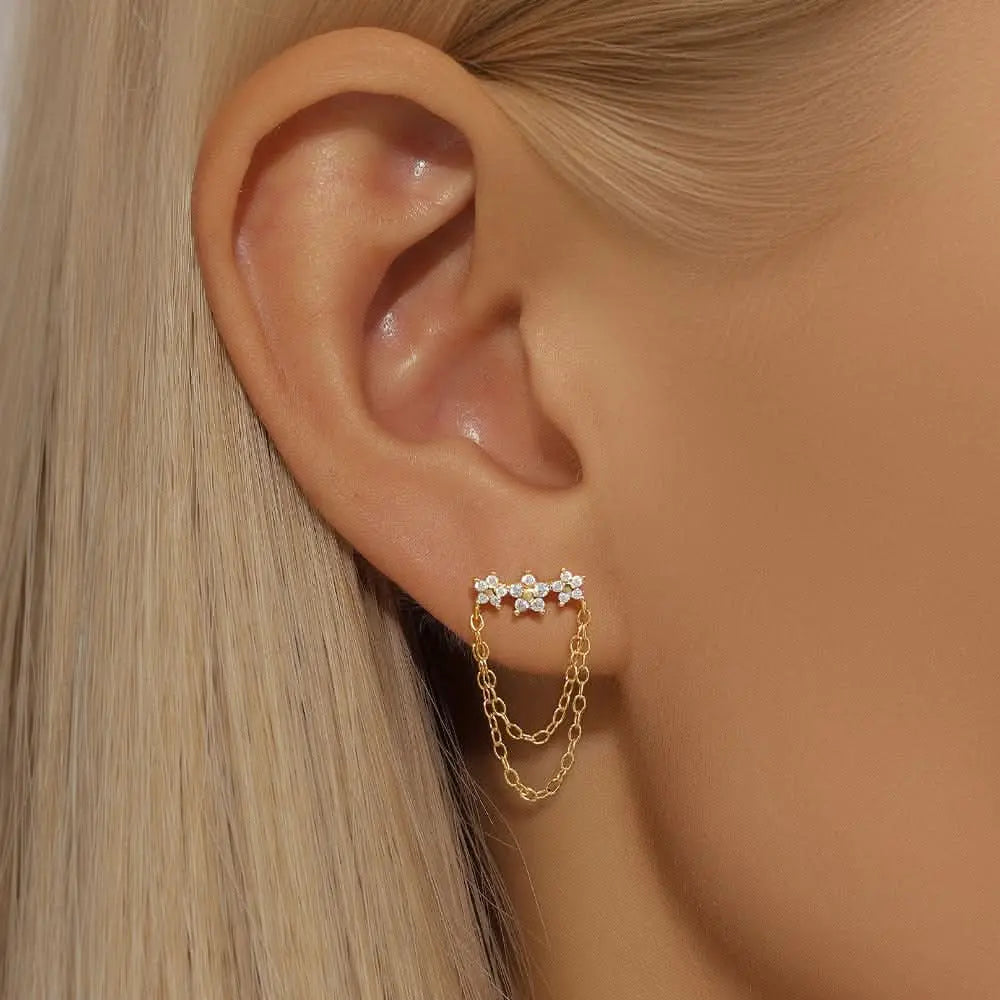 Gold leaf chain ear cuff with cubic zirconia crystals, a unique and modern earring for women.