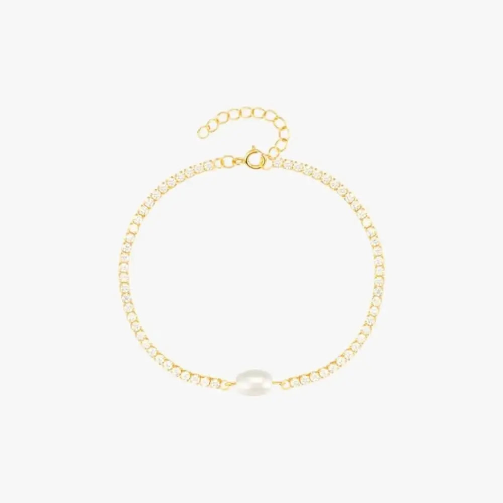 Luxury gold bracelet with a minimalist design featuring a central pearl.