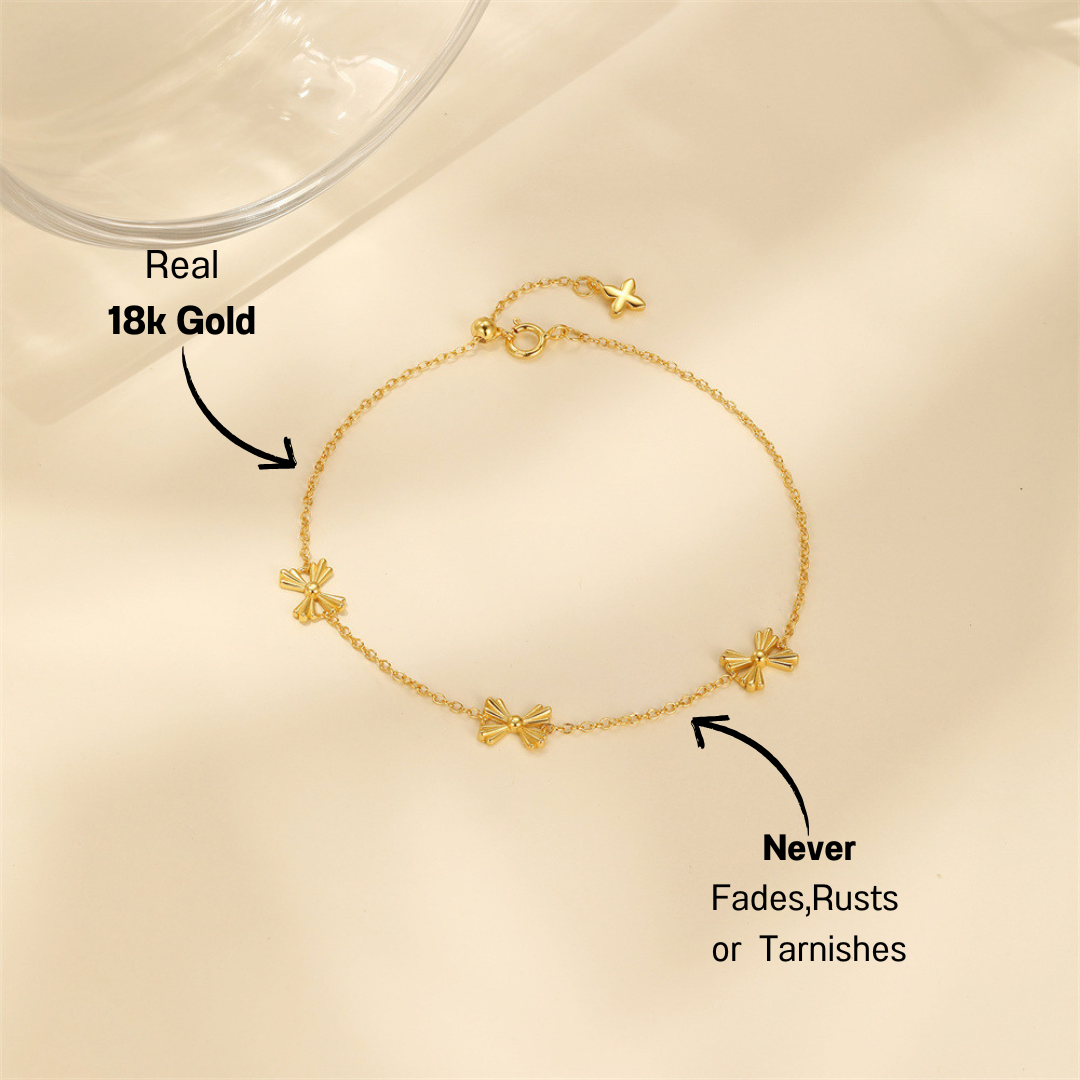 Minimalist butterfly charm bracelet in gold-plated sterling silver, perfect for everyday elegance.