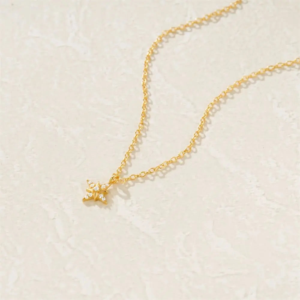 Minimalist gold star pendant necklace, featuring sparkling accents for a modern chic style