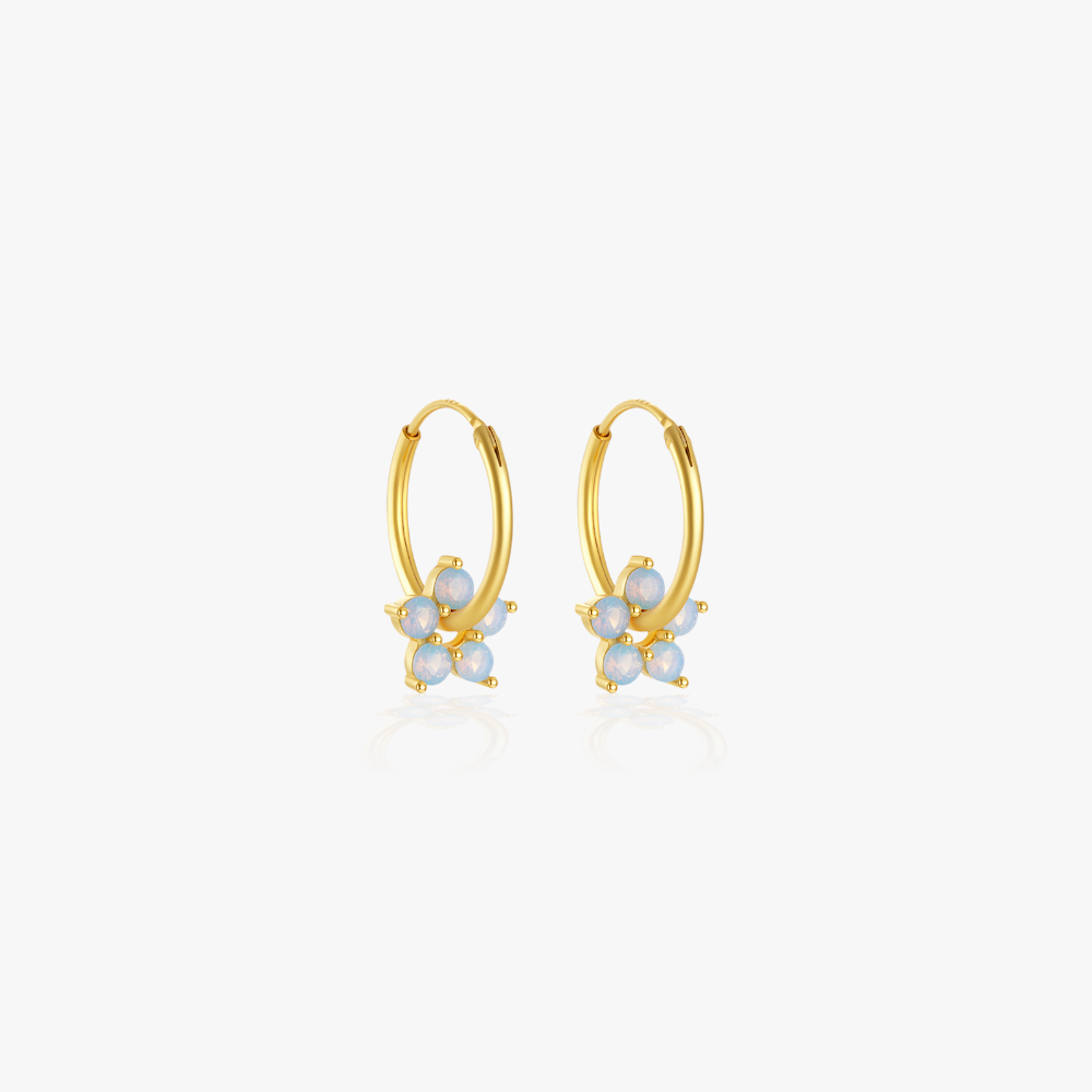 Minimalist gemstone flower earrings in gold, a dainty and versatile jewelry piece.