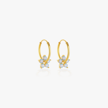 Minimalist gemstone flower earrings in gold, a dainty and versatile jewelry piece.