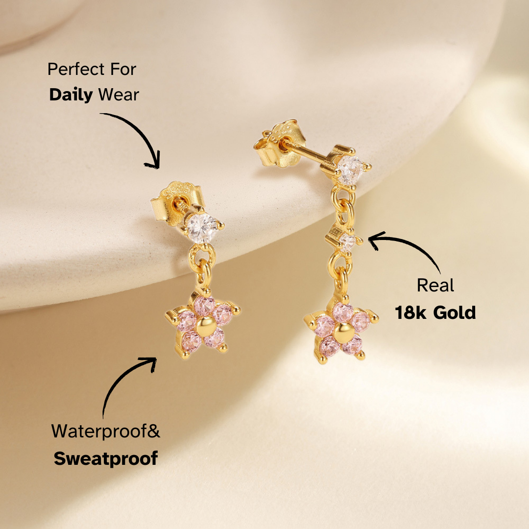 Delicate pink crystal flower earrings with a drop design, featuring high-quality cubic zirconia. A must-have for women who love elegant jewelry.