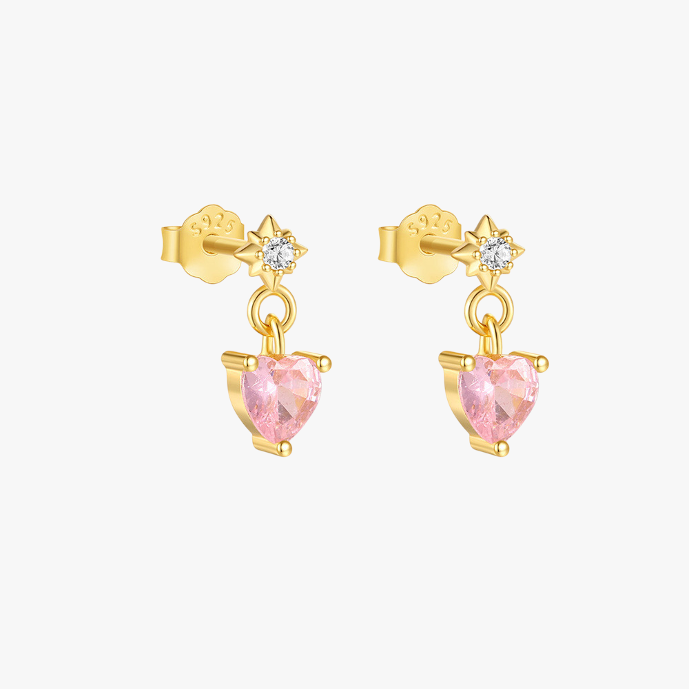 Dainty gold heart earrings with pink gemstone dangles. Elegant and romantic jewelry for women.