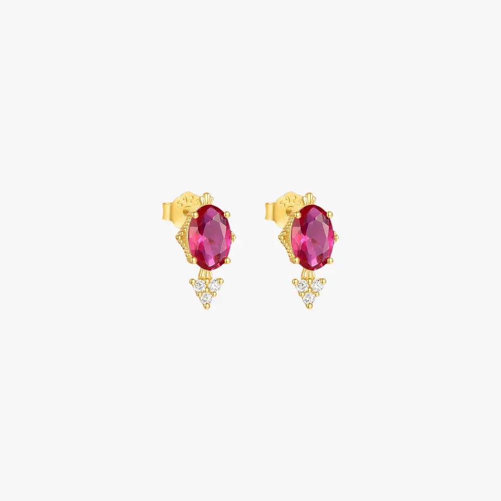 Red ruby and gold diamond earrings for a luxurious look.