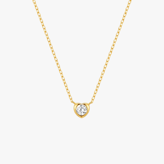 Minimalist gold heart-shaped pendant necklace with a zircon center