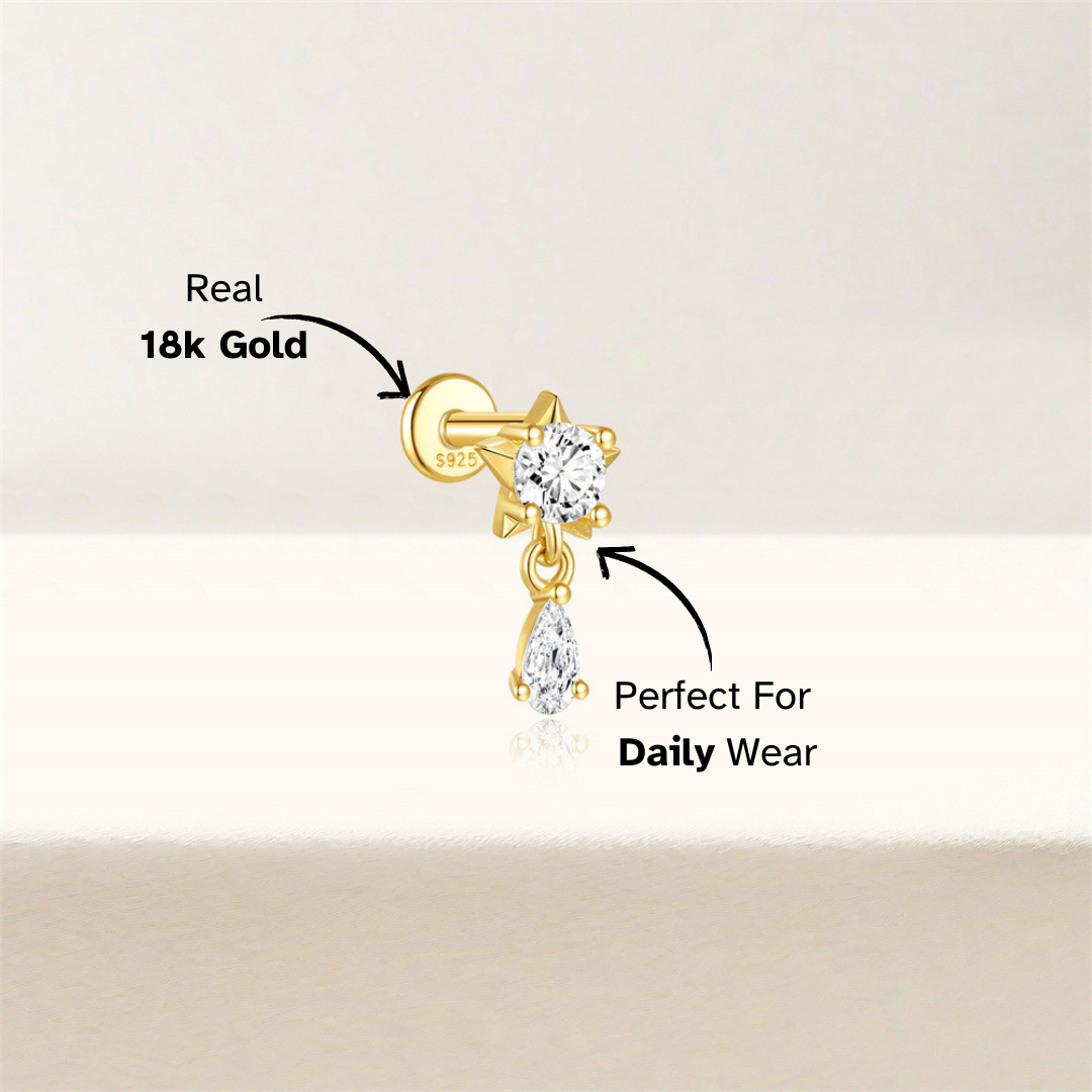 Single star zirconia cartilage earring in S925 sterling silver with gold plating. Ideal for helix, tragus, or lobe piercings, this minimalist earring is stylish and hypoallergenic.