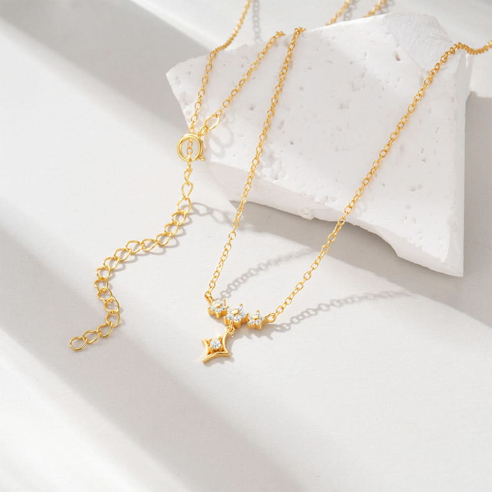 Dainty star diamond necklace on a gold chain, a timeless and sophisticated piece for any occasion.