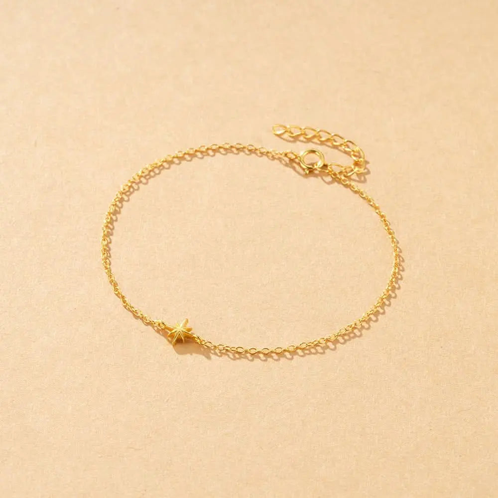 Minimalist gold bracelet featuring a star charm, bringing elegance to any style.