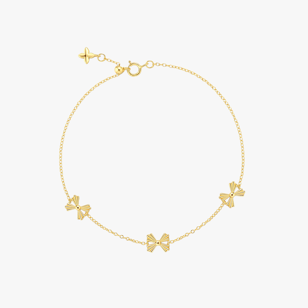 Elegant S925 sterling silver butterfly bracelet in gold, featuring delicate bow-shaped charms.