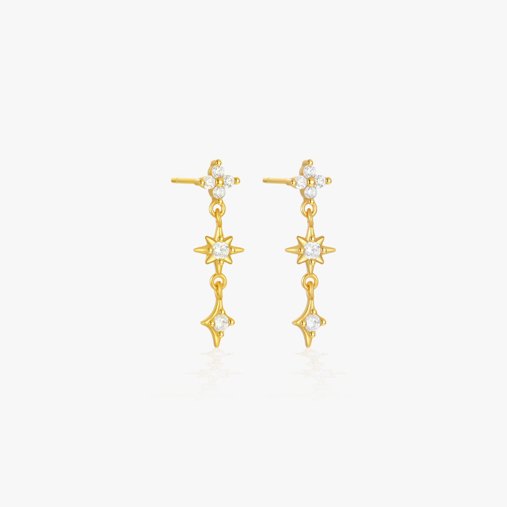 Triple star diamond gold drop earrings, a statement accessory for refined elegance.