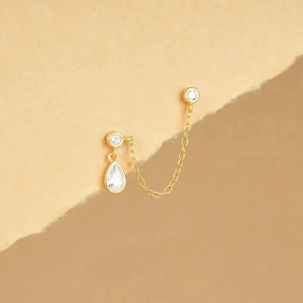 S925 sterling silver teardrops with diamonds on chain clauses earrings on vellum background