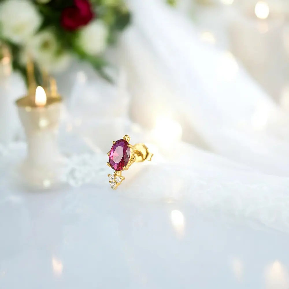 Stand out with these bold ruby-inspired earrings, accented with sparkling crystals.